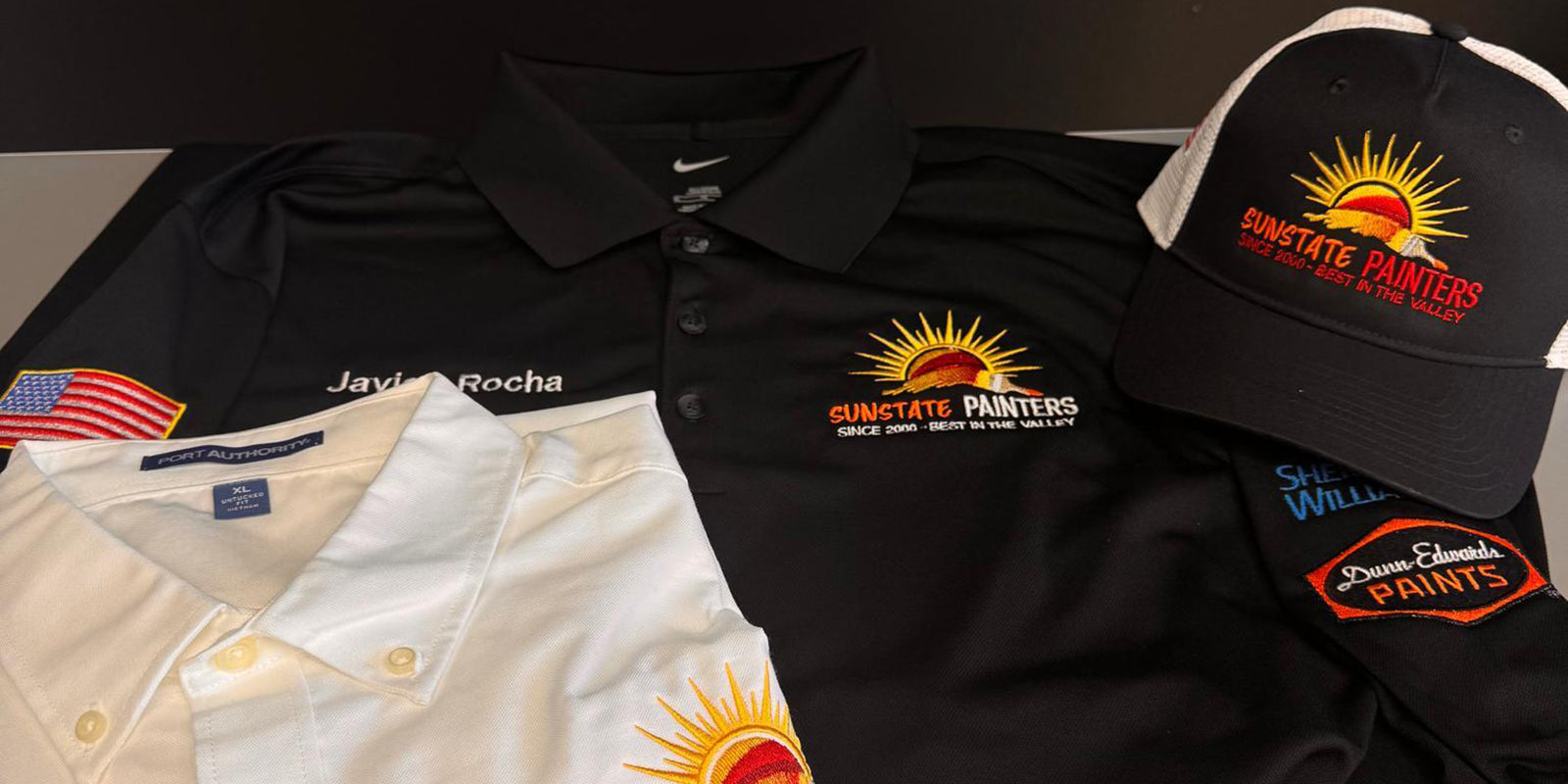custom embroidered hat and shirts featuring sunstate painters and sherwin william logo